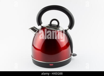 Beautiful design sleek red modern electric water boiler kitchen kettle isolated on white background Stock Photo