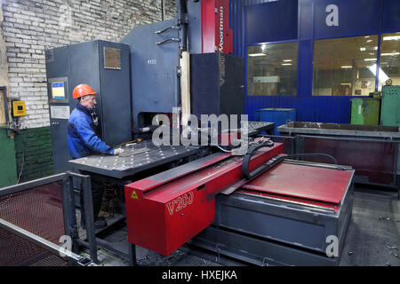 St. Petersburg, Russia - October 10, 2014: Plant for the production of metal structures, work the operator controls the drilling machine.  Metal proce Stock Photo
