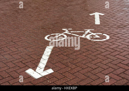 On the paving slab there is a road sign 'Bike path'