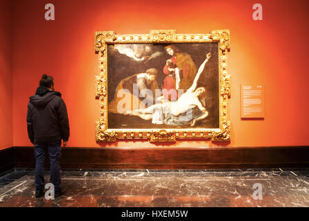 Bilbao, Spain: a man looking at Saint Sebastian tended by the Holy Women, painting by Jose de Ribera at Bilbao Fine Arts Museum Stock Photo