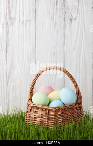 Easter eggs basket in grass meadow Stock Photo