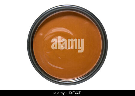 Bowl of melted chocolate isolated on white background Stock Photo