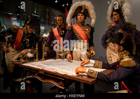 Waxwork models of Napoleon's generals (incl Marechal Soult, centre), re-enact the night before the Battle of Waterloo forming an exhibit inside the Memorial 1815 exhibition at the battlefield, on 25th March 2017, at Waterloo, Belgium. Inaugurated on the battle's bicentenary, visitors experience the history of Napoleonic Europe and the armies of both the French and allied armies on that day. The Battle of Waterloo was fought 18 June 1815. A French army under Napoleon Bonaparte was defeated by two of the armies of the Seventh Coalition: an Anglo-led Allied army under the command of the Duke of W Stock Photo