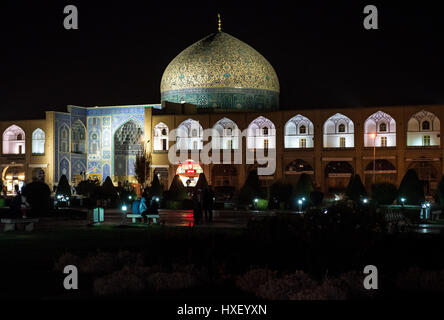 Night view of Naqsh-e Jahan Square (Imam Square, formlerly Shah Square) in centre of Isfahan in Iran. Sheikh Lotfollah Mosque dome on photo Stock Photo