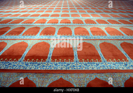 The Ottoman imperial mosque Bayezid II Mosque is located in the Fatih district of Istanbul and the interior covered by prayer carpet. Stock Photo