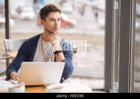 Young handsome guy working on computer Stock Photo