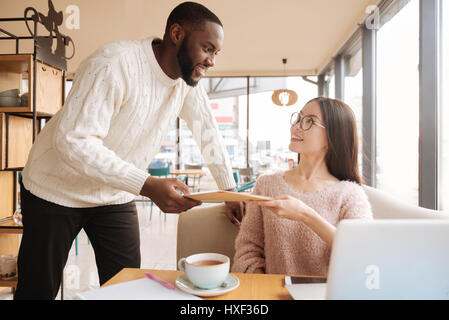 Positive students resting in the cafe Stock Photo