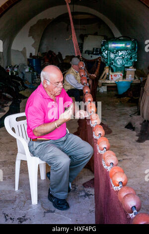 SCIACCA, ITALY - October 18, 2009: Fisherman in Sciacca, Italy. Sciacca is known as the city of thermal baths since Greek Stock Photo