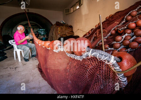 SCIACCA, ITALY - October 18, 2009: Fisherman in Sciacca, Italy. Sciacca is known as the city of thermal baths since Greek Stock Photo