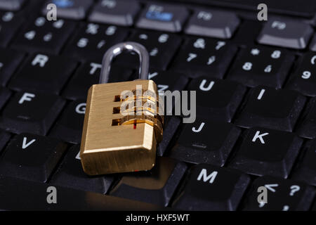 golden lock on black keyboard - computer security concept, internet privacy Stock Photo
