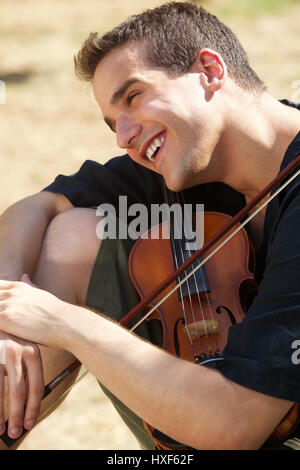 Portrait of a smiling man with his violin Stock Photo