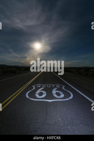 Desert moon over Route 66 sign in eastern San Bernardino County, California. Stock Photo
