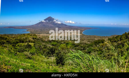 Vista or view from part way up Volcan Maderas, over the isthmus  towards Volcan Concepcion, Isla Ometepe, Nicaragua Stock Photo