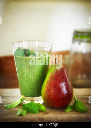 Healthy pear spinach and quinoa detox breakfast smoothie Stock Photo