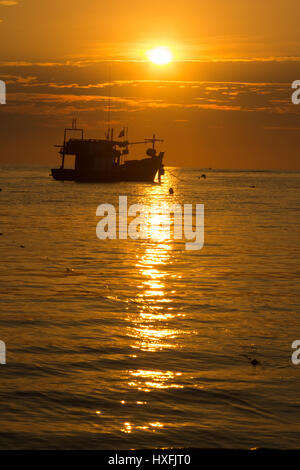 Silhouettes of boats at Bang Tao beach, Phuket, Thailand Stock Photo