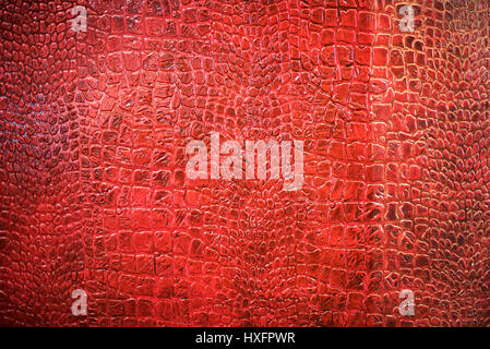 Background texture of red snake skin showing the structure of the scales in a full frame view for fashion concepts Stock Photo