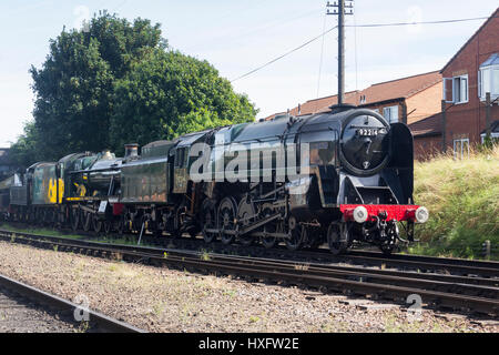 Class 9F 92214 'Leicester City' and 6990 'Witherslack Hall', steam engines at Loughbrough railway station on the Great Central Railway Stock Photo