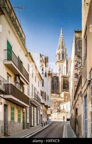 Carrer d'Artà in Manacor, rear: neo-gothic church Nostra Senyora dels Dolors with bell tower Torre Rubí, Manacor, Mallorca, Balearic Islands, Spain Stock Photo