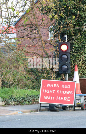 temporary traffic lights at a roadworks site england Stock Photo - Alamy