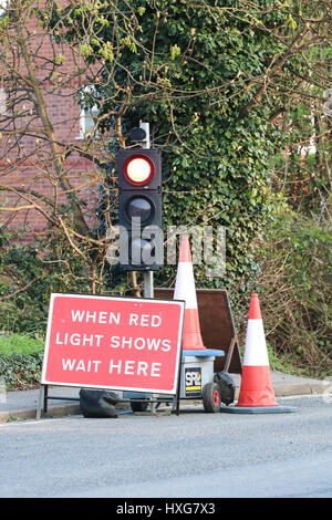 temporary traffic lights at a roadworks site england Stock Photo - Alamy