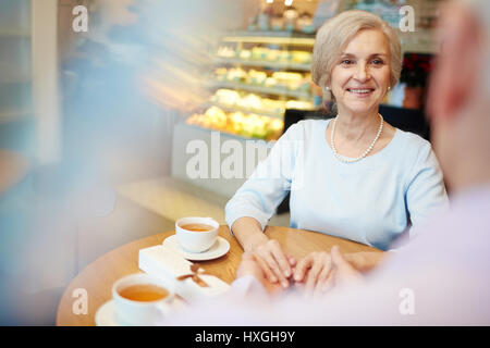 Senior spouses having romantic evening in cafe Stock Photo