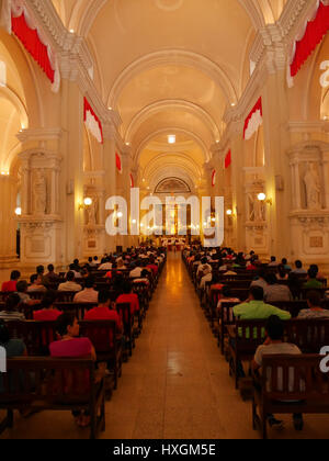 Inside the church during mass in Nicaragua, crowded people praying celebrating Stock Photo