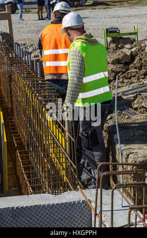 two workers on a construction site with armature Stock Photo