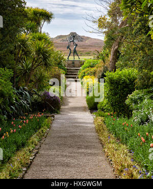 Vista in Tresco Abbey Garden in the Isles of Scilly with David Wynne's sculpture of Tresco Children forming a focal point Stock Photo