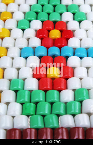 Retro vintage barrel glass beads. Beading flower hobby close up photo. Stock Photo