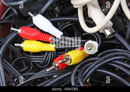 Cable texture. Cables background. Audio video rca jack power cord and black cables on white background. Stock Photo