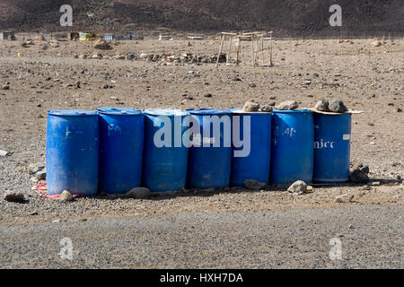 Blue plastic drums in rural areas for distributing water  in Djibouti East Africa Stock Photo