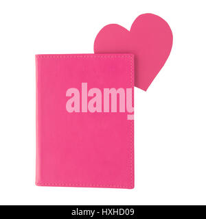 Pink paper heart bookmark inside a pink book isolated on white background Stock Photo