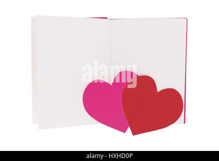 Pink and red paper heart on blank open book isolated on white background Stock Photo
