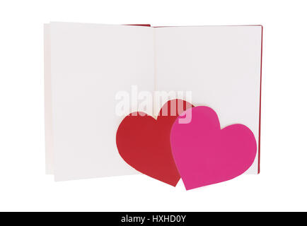 Red and pink paper heart on blank open book isolated on white background Stock Photo
