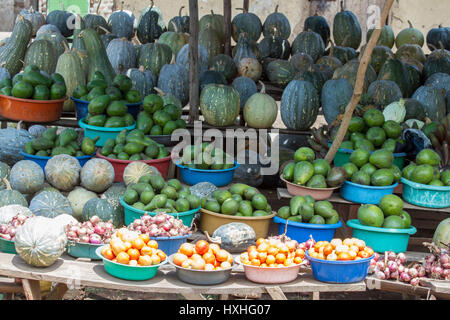 Fresh fruits and vegetables on display at roadside produce stand in Uganda, Africa. Stock Photo