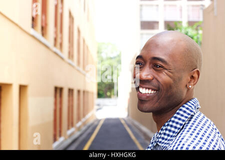 Close up portrait of smiling older african man in the city Stock Photo