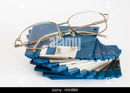 Eye glasses on floppy disks Stock Photo