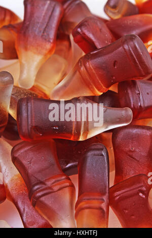 Cola gum candy. Gummy candy cola flavored sweet snack. Cola bottle shaped sweets. Stock Photo