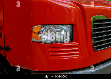 Front end of a semi truck while parked red truck Stock Photo