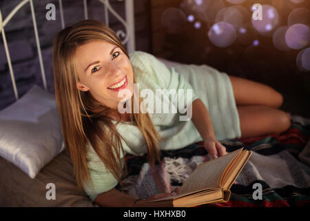 Woman resting at the book Stock Photo