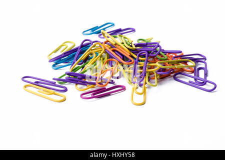 A pile of multicolored paperclips on a white background. Stock Photo
