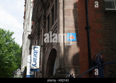 Space Invader street art by the French artist Invader near Trafalgar Square in central London Stock Photo