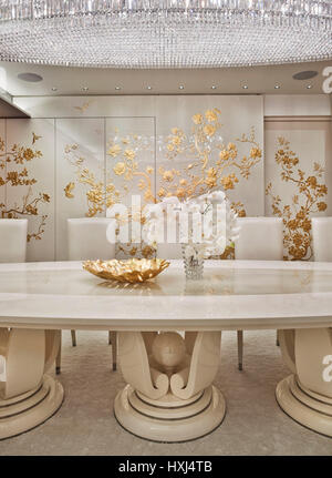 White-gold dining room in a luxury apartment in London Stock Photo