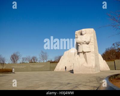 Martin Luther King Jr Memorial with single person, under crystal clear blue skies in early spring, Washington, DC, USA Stock Photo