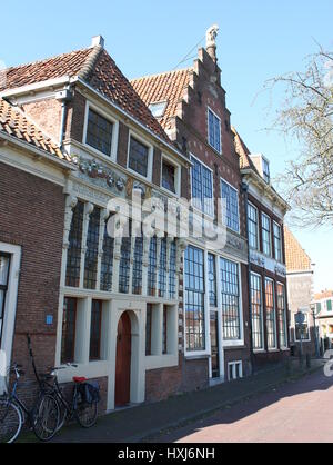 17th century Bossuhuizen (Houses of Bossu), Hoorn, Netherlands with gablestones depicting the Battle on the Zuiderzee in 1573 against the Spanish. Stock Photo