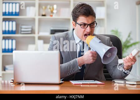 Angry aggressive businessman in the office Stock Photo