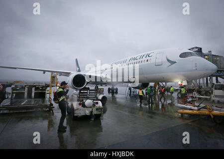 Vancouver, Canada. 28th Mar, 2017. Photo taken on March 28, 2017 shows an Airbus A350-900 passenger jet after it landed at Vancouver International Airport in Vancouver, Canada, on March 28, 2017. A new Airbus A350-900 passenger jet made its first scheduled flight to Canada on Tuesday and began Cathay Pacific's use of the plane for its Vancouver-Hong Kong route. Credit: Liang Sen/Xinhua/Alamy Live News Stock Photo