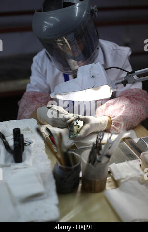 Giza, Egypt. 29th March 2017. An archaeologist works on parts of the second solar boat of Pharaoh Khufu at the restoration laboratory located in Giza, Egypt on March 29, 2017. Egypt opened its largest on-site antiquities laboratory to restore Pharaoh Khufu's second solar boat. King Khufu was a famous fourth dynasty Pharaoh who built the great Khufu Pyramid. His solar boat was designed to ferry him to the afterlife according to ancient Egyptian beliefs. Credit: Xinhua/Alamy Live News Stock Photo