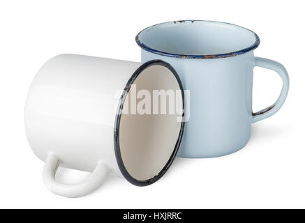Two old enameled mugs beside isolated on white background Stock Photo