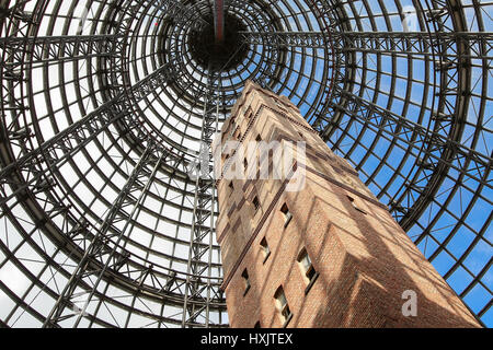 MELBOURNE, AUSTRALIA - OCTOBER 31, 2016: Underneath a hugh glass dome, Coop's Factory Shot Tower, built in 1888, is located in Melbourne Central shopp Stock Photo